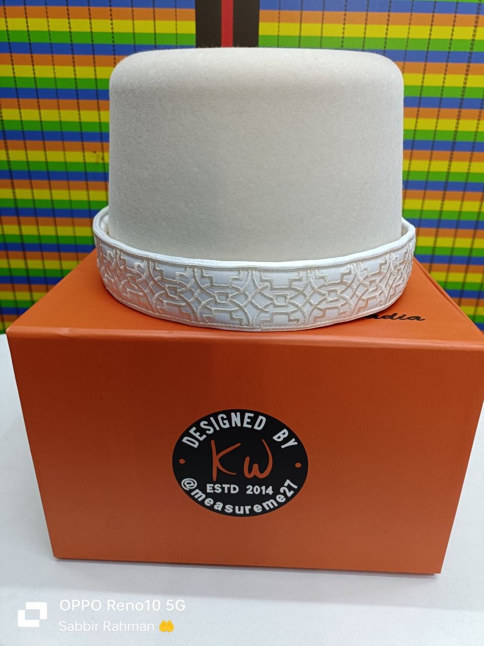 White hat with white geometrical embroidery